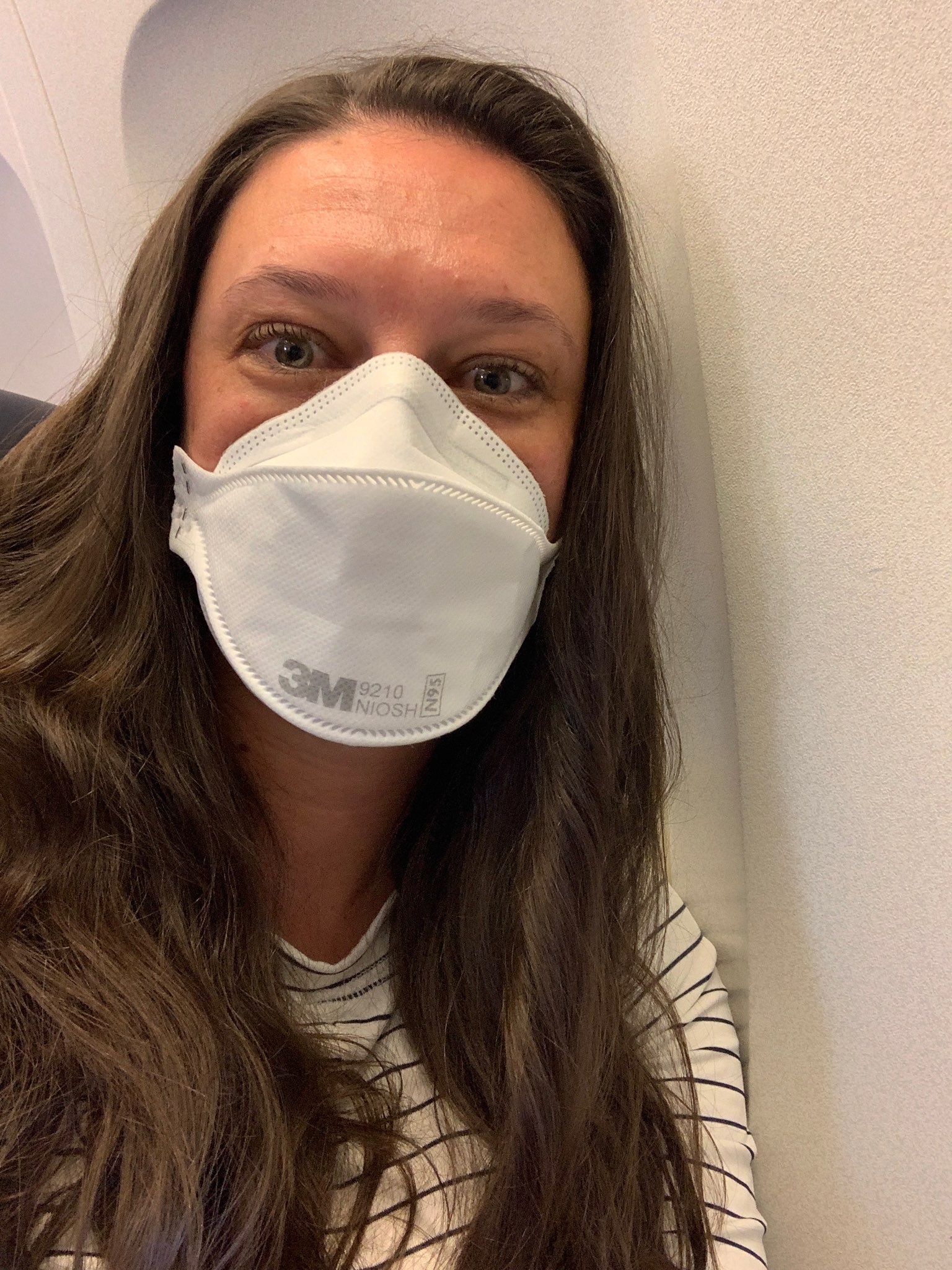 Christa Hyson wears an N-95 mask